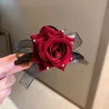 Detailed view of a dark red velvet rose hair clip featuring a black lace mesh bow. - Floral Style (22#)