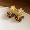 Elegant gold-tone flower earrings featuring sparkling zircon and tiger eye stone beads - Hollow Flower Style (34#)