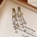 Retro silver needle earrings with resin flowers and bead tassels in vintage style. - Tassel Flower Style (105#) / Black and White