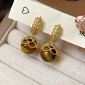 Elegant vintage gold earrings with zircon and tiger eye stone beads on display card - Hollow Lace Style (12#)