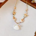 Bohemian style necklace featuring shell and starfish pendants on a tan wax cord - Ocean Style Scallop Artificial Pearl Bow Necklace / 9# Necklace-White-Coffee