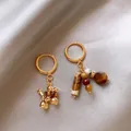 Asymmetric gold hoop earrings featuring tiger eye stones and a cute balloon dog charm - Asymmetric Design Style (57#)