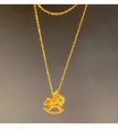 Detailed view of a golden rocking horse pendant necklace on a dark grey background - Lucky Horse Coin Necklace-Gold (Real Gold Plated)