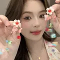 Close-up of floral drop earrings demonstrated by a model for a sweet summer look - Silver Post Style (02#) / Colorful