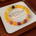 Dettaglio del bracciale vintage in cristallo di pietra del sole con perla dorata. - Stile 42 (Bicolore) / Giallo/Rosa