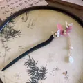 Elegant wooden butterfly hairpin with pink resin wings and dangling gold tassel detail - Pink Butterfly Swing Style (HH6014)