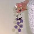Elegant long purple glass lily of the valley earrings featuring golden butterfly studs design - Purple Butterfly Lily of the Valley Tassel Earrings
