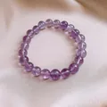Bracciale in perle di cristallo viola naturale con gemme rotonde lucidate su seta - 0.8mm / Viola