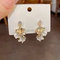 Exquisite gold petal-shaped dangle earrings featuring zircon studs and S925 silver needles - Gold White (74)