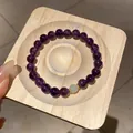 Bracciale vintage con perle di cristallo viola scuro, dettaglio verde e finiture dorate - Stile 29 (WB419) / Viola