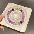 Bracciale artigianale con perline di cristallo viola e trasparente su vassoio di legno - Stile 31 (WB419) / Viola