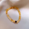 Elegante bracciale in cristallo di sole con ciondolo a fiore dorato su seta champagne - 5mm / Giallo