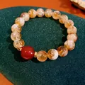 Bracciale vintage con agata rossa e cristallo di pietra del sole dorata, vista SKU. - Stile 65 (Bicolore) / Giallo/Rosso