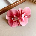 Detailed view of elegant pink orchid fabric hair clips featuring central pearl beads - Red Flower (HH8269) / Red