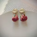 Elegant silver needle earrings featuring delicate pink preserved rose flower buds - Stud Style (HE6520) / 1 Pair Pack / Pink Rose