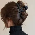 Large matte black hair claw clip for thick hair featuring a minimalist curved design - Matte Twisted Style / Black Matte