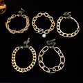 Close-up detail of five chunky gold chain bracelets showcasing trendy hip-hop layered styles - Five-Piece Set / Gold