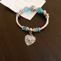 Elegant blue glass bead bracelet featuring vintage heart-shaped charms with love engravings. - Silver Blue Heart Style (55#)