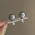 Close-up detail of elegant grey double-sided pearl stud earrings on a white card - Steel Earring Post / Gray