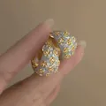 Floral enamel hoop earrings with rhinestone accents in a golden and grey finish - Gold Hoop Earrings / Blue