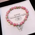 Pink marbled glass beaded bracelet featuring a sparkling butterfly and flower charm - Butterfly Pendant Style (100#) / Pink-Silver