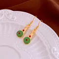 Elegant gold-tone traditional Chinese Pipa-shaped drop earrings with green and red accents - Earring Hook (92) / Gold-Green