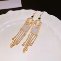 Elegant gold tassel earrings with white jade-like stone in Neo-Chinese vintage style. - Earring Hook (100) / Gold