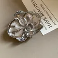 Vintage silver orchid flower brooch with hammered metal texture for women's fashion - Silver