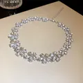 Exquisite flower-shaped choker necklace featuring sparkling crystals with a silver-tone finish. - Flower Necklace / Silver