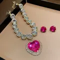Close-up detail of heavy luxury heart-shaped pink crystal necklace and earring jewelry set - Rose Red Necklace (Two-Piece Set)