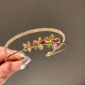 Close-up of an elegant double-layer gold cuff bracelet with colorful zircon flowers. - Double Layer Flower Open Bracelet (HB3112) / Gold-Multicolor