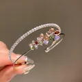 Macro detail of elegant double-layered open bracelet with colorful zircon flowers - Double Layer Flower Open Bracelet (HB3112) / Silver - Rainbow