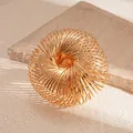 Close-up macro view of a luxury gold-toned multi-layer spiral arm cuff on stone - Multi-Layer Spiral Style (25#) / Gold