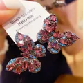 Detailed view of vintage butterfly earrings with pink crystals and silver 925 tag - 16# Silver Needle - Red And Blue