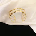 Elegant multi-layer gold open cuff bracelet on white silk background - 78# Multi-layer Intertwined Style / Gold