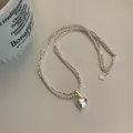 Dubbellaagse ketting van zilveren kralen en parels met een gepolijste zilveren hart hanger - 1# Ketting-Harthanger / Zilver-Wit