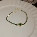 Elegant gold-plated tennis bracelet featuring green heart zircon and adjustable chain closure - Green Heart Style (66#)