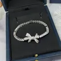 Sparkling silver plated zircon bow bracelet presented in a navy blue luxury jewelry box - Bow-knot Geometric Style (69#)
