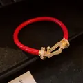 Red braided cord bracelet with gold-plated horseshoe clasp and sparkling cubic zirconia - Horse-shoe Buckle Braided Rope Style (121#)