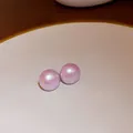 Elegant pink iridescent pearl stud earrings with a smooth round minimalist finish - Light Purple-Iridescent Bead