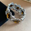Detailed shot of vintage Bohemian stretch bracelet with tortoise acrylic stones - Coffee