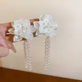 Elegant vintage-style white flower earrings featuring long pearl tassels and silver needles. - Flower Tassel (28)
