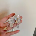 Elegant vintage floral pearl earrings featuring grey teardrop charms and S925 silver needles - White Petal Pendant (32)