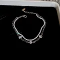 Elegante pulsera de plata de doble capa con brillantes colgantes de flores de circonio - Plateado
