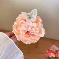 Elegant pink rose floral hair claw clip featuring a delicate embroidered butterfly - Embroidered Butterfly Rose Hair Claw / Apricot