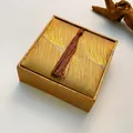 Luxury gold fabric square jewelry box with elegant tassel detail for necklace storage - Bracelet Box / Gold Feather
