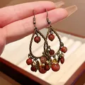 Detail view of vintage neo-Chinese style water drop earrings with red stone beads - Ear Hook (HE18491) / Antique Gold