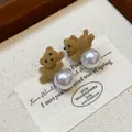 Detailed close-up of cute flocked brown teddy bear pearl stud earrings displayed on a vintage card - Flocked Bear Pearl / Coffee/White (8#)
