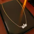 Close-up of vintage golden butterfly necklace with white zircon on black display box - Style 23-Gold-Electroplated
