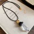 Retro leather cord necklace featuring a frosted teardrop pendant and elegant wooden beads - Style 41-Black Gold White